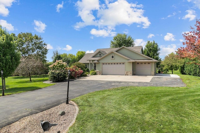 view of front facade with a garage and a front lawn