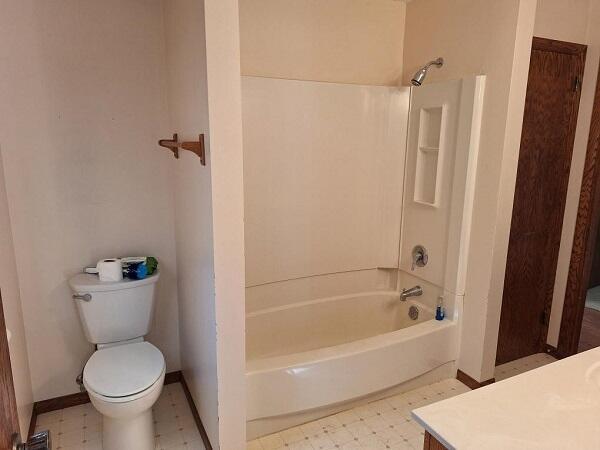 full bathroom with vanity, toilet, and shower / washtub combination