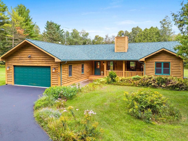 log-style house featuring a shingled roof, a front lawn, a porch, and an attached garage