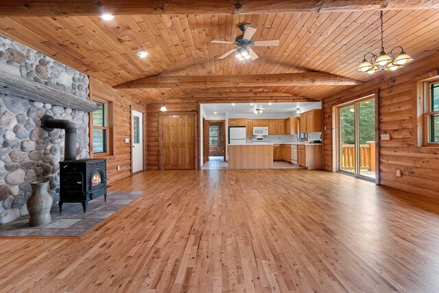 unfurnished living room featuring light hardwood / wood-style floors, lofted ceiling with beams, a wood stove, and wooden ceiling