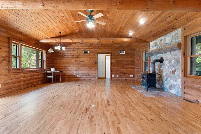 unfurnished living room featuring visible vents, wood ceiling, a wood stove, vaulted ceiling, and hardwood / wood-style floors