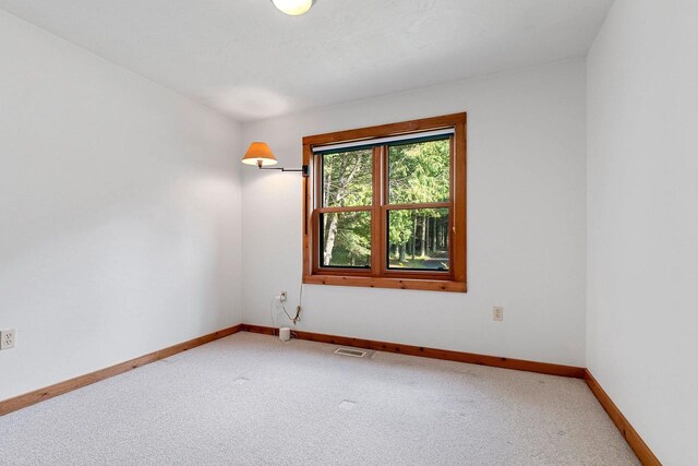 empty room featuring carpet flooring