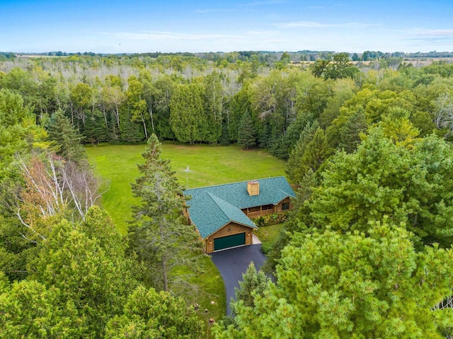 birds eye view of property with a forest view