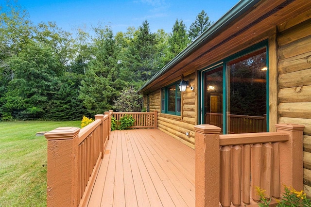 wooden deck with a lawn