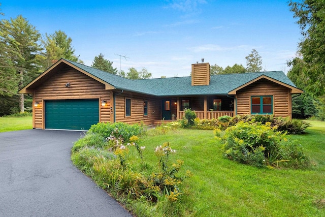 log-style house with a front yard, covered porch, and a garage