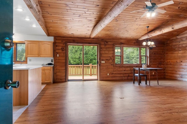 unfurnished dining area with light hardwood / wood-style floors, vaulted ceiling with beams, wooden ceiling, and log walls