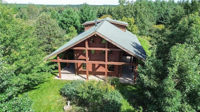 back of property with an outdoor structure