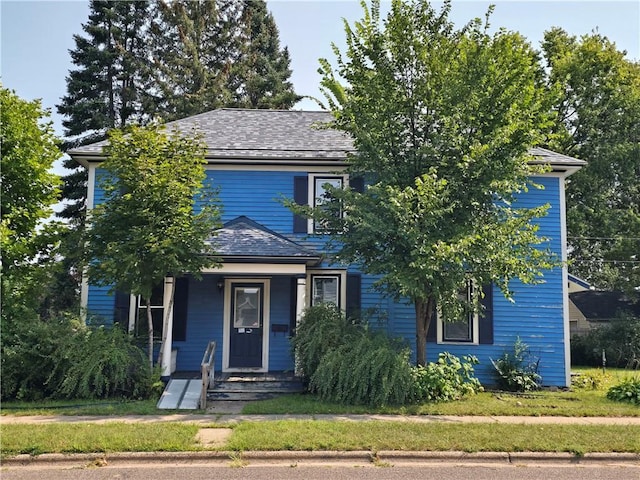 obstructed view of property with a porch