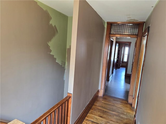 corridor featuring dark hardwood / wood-style flooring