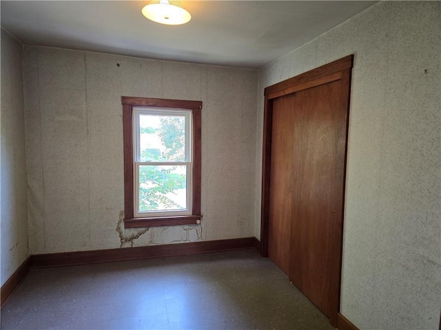 unfurnished bedroom with a closet