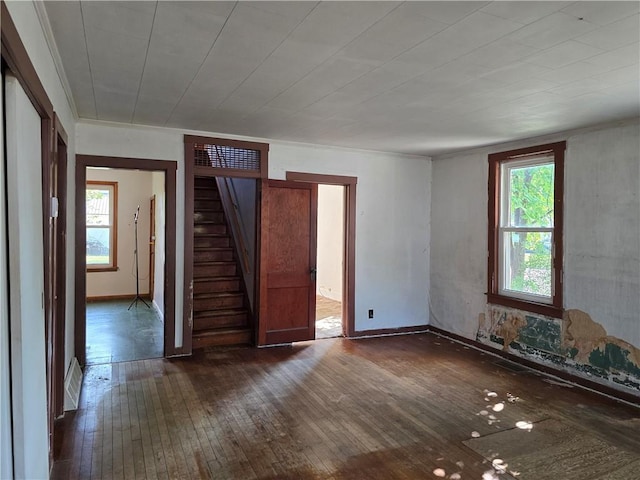 unfurnished bedroom with dark hardwood / wood-style flooring