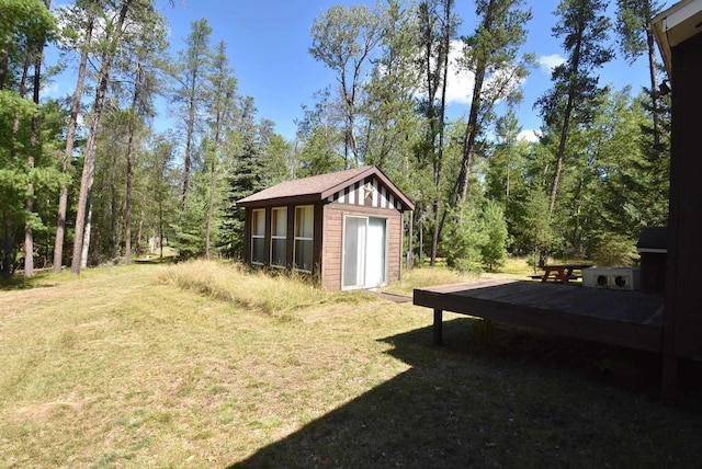 view of yard featuring an outbuilding and a deck