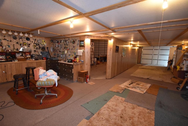 interior space featuring a workshop area and wooden walls