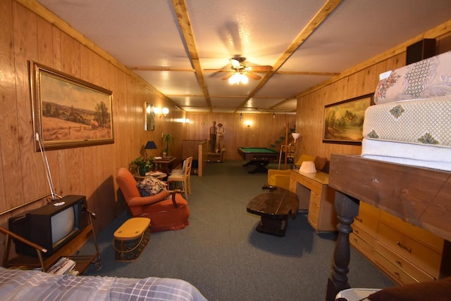 interior space with wooden walls, ceiling fan, and billiards