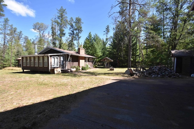 view of yard with a sunroom