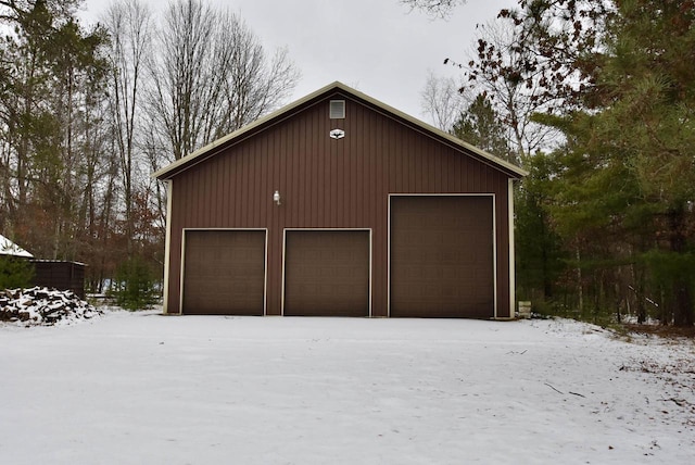 view of snow covered garage