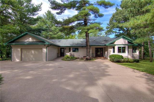 ranch-style home featuring a garage