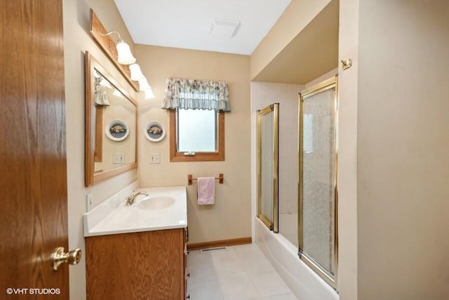 bathroom with baseboards, visible vents, bath / shower combo with glass door, and vanity