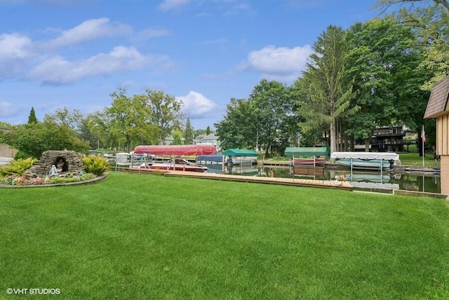 exterior space featuring a dock and a yard