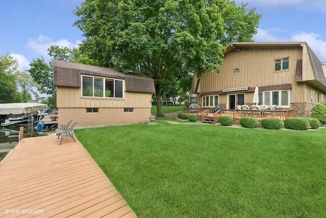 back of house featuring a lawn