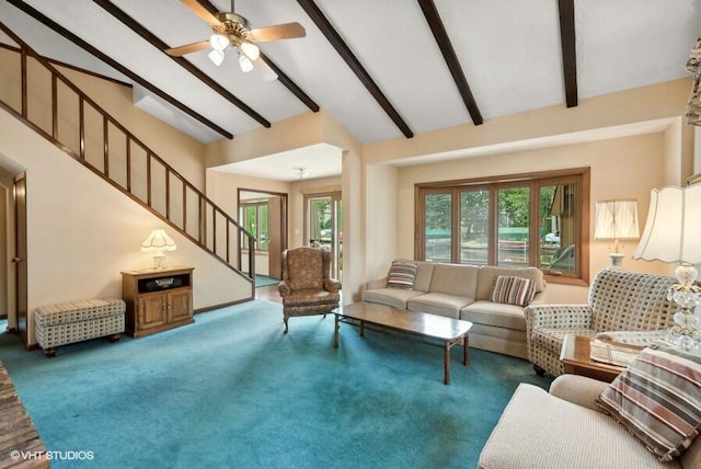 living area featuring vaulted ceiling with beams, plenty of natural light, carpet flooring, and stairs