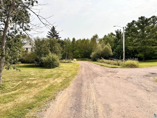 1118 Prentice Ave, Ashland, WI 54806 - view of dirt / gravel road with street lights