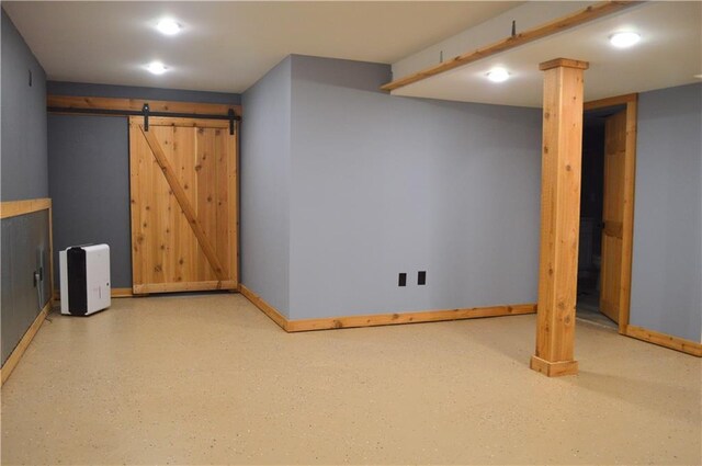 basement featuring a barn door