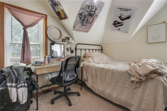 carpeted bedroom with multiple windows and lofted ceiling