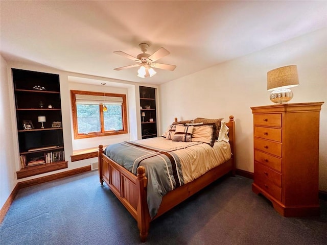 bedroom featuring dark carpet, a ceiling fan, and baseboards