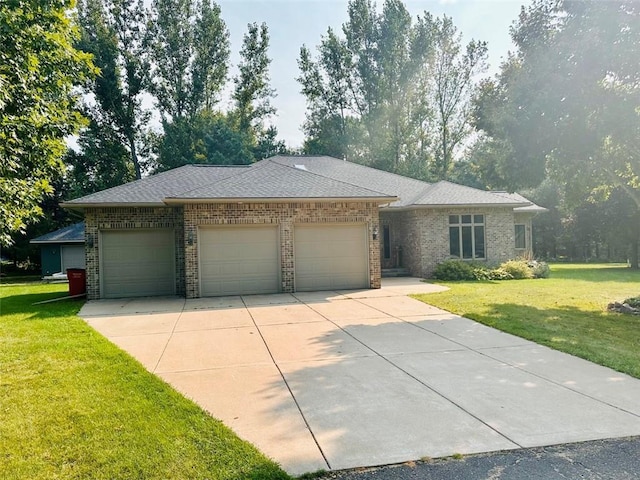 ranch-style house with a front lawn, concrete driveway, brick siding, and a garage