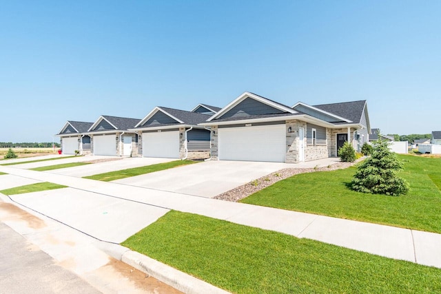 view of front of home featuring a garage and a front lawn