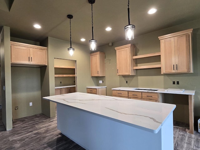 kitchen featuring light brown cabinets, hanging light fixtures, and dark wood-type flooring