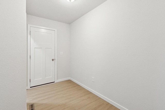 spare room with light hardwood / wood-style flooring