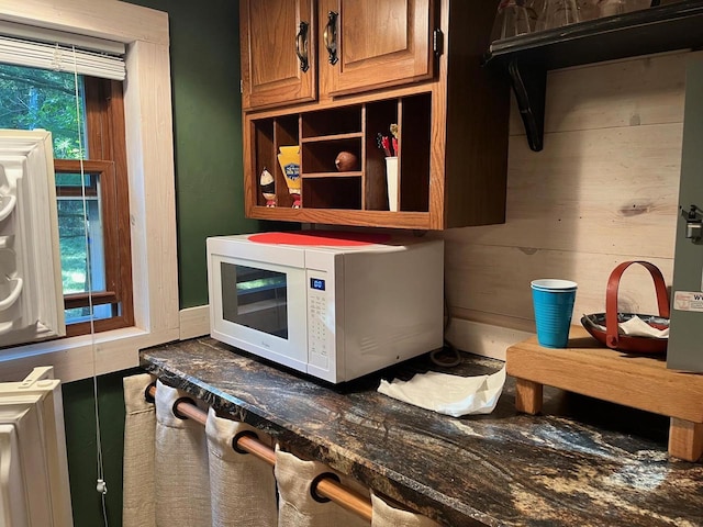 interior space featuring dark stone countertops