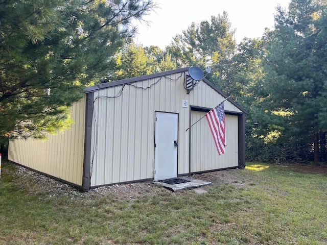 view of outbuilding with a lawn