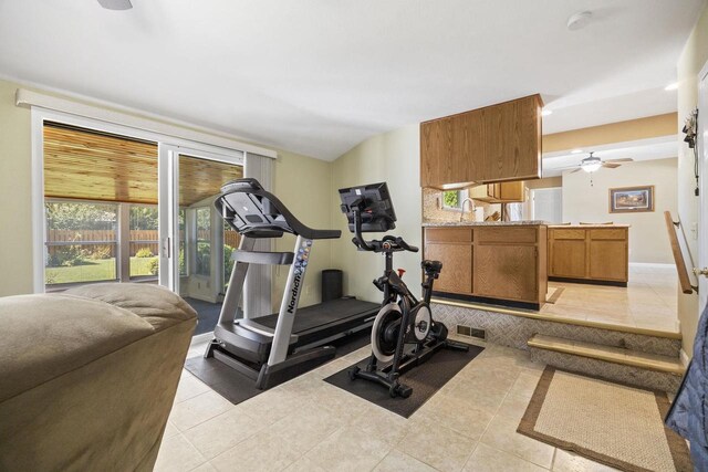 workout room featuring light tile patterned floors and visible vents