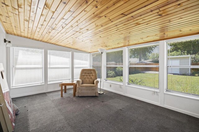 unfurnished sunroom with vaulted ceiling and wood ceiling