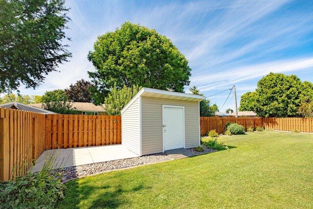 view of shed with a fenced backyard