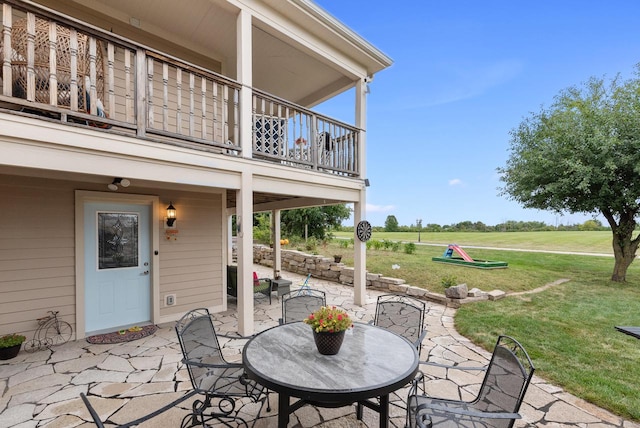 view of patio featuring a balcony