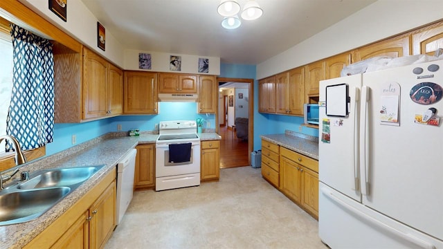 kitchen featuring sink and white appliances