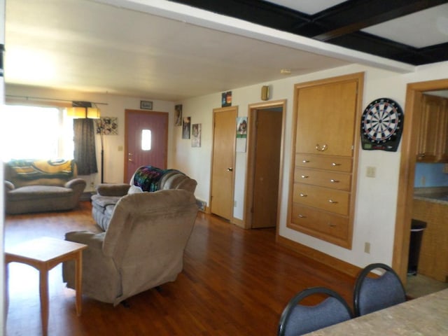 living room with beamed ceiling and dark hardwood / wood-style floors