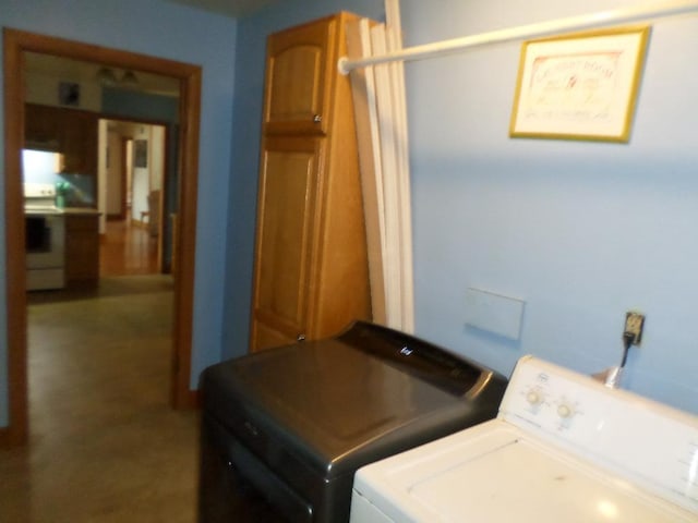 clothes washing area with independent washer and dryer