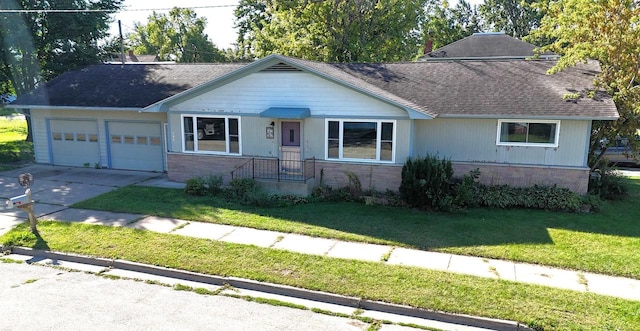 single story home featuring a front yard and a garage