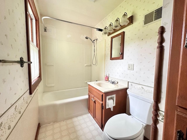 full bathroom featuring toilet, tub / shower combination, and vanity