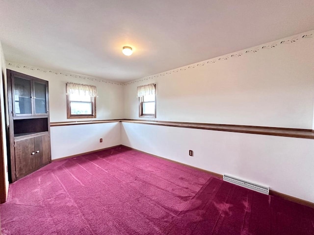 unfurnished room featuring carpet floors