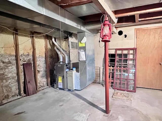 utility room featuring heating unit