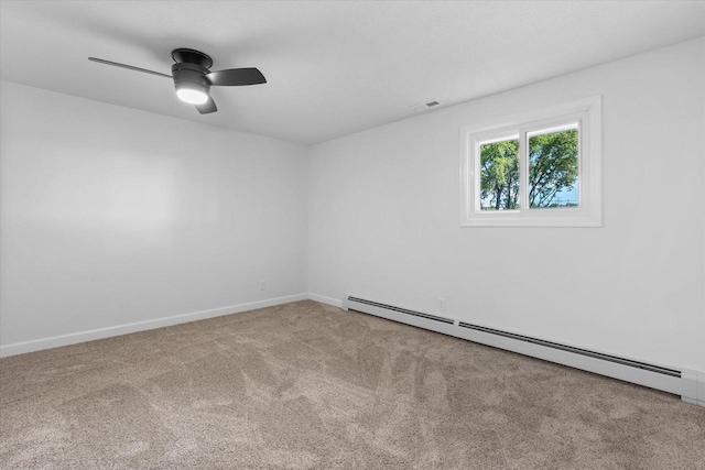 carpeted spare room with a baseboard heating unit, visible vents, baseboards, and a ceiling fan