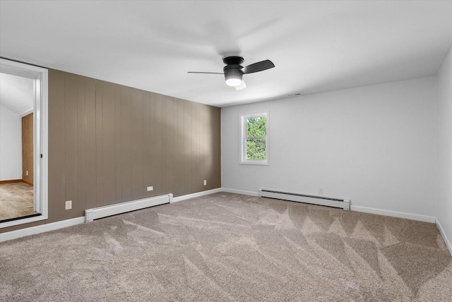 unfurnished room featuring carpet, ceiling fan, a baseboard radiator, and baseboards