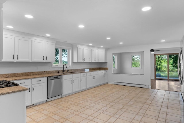 kitchen with a baseboard heating unit, recessed lighting, dishwasher, and a sink