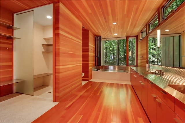 full bathroom with toilet, a sink, wood finished floors, recessed lighting, and wooden ceiling